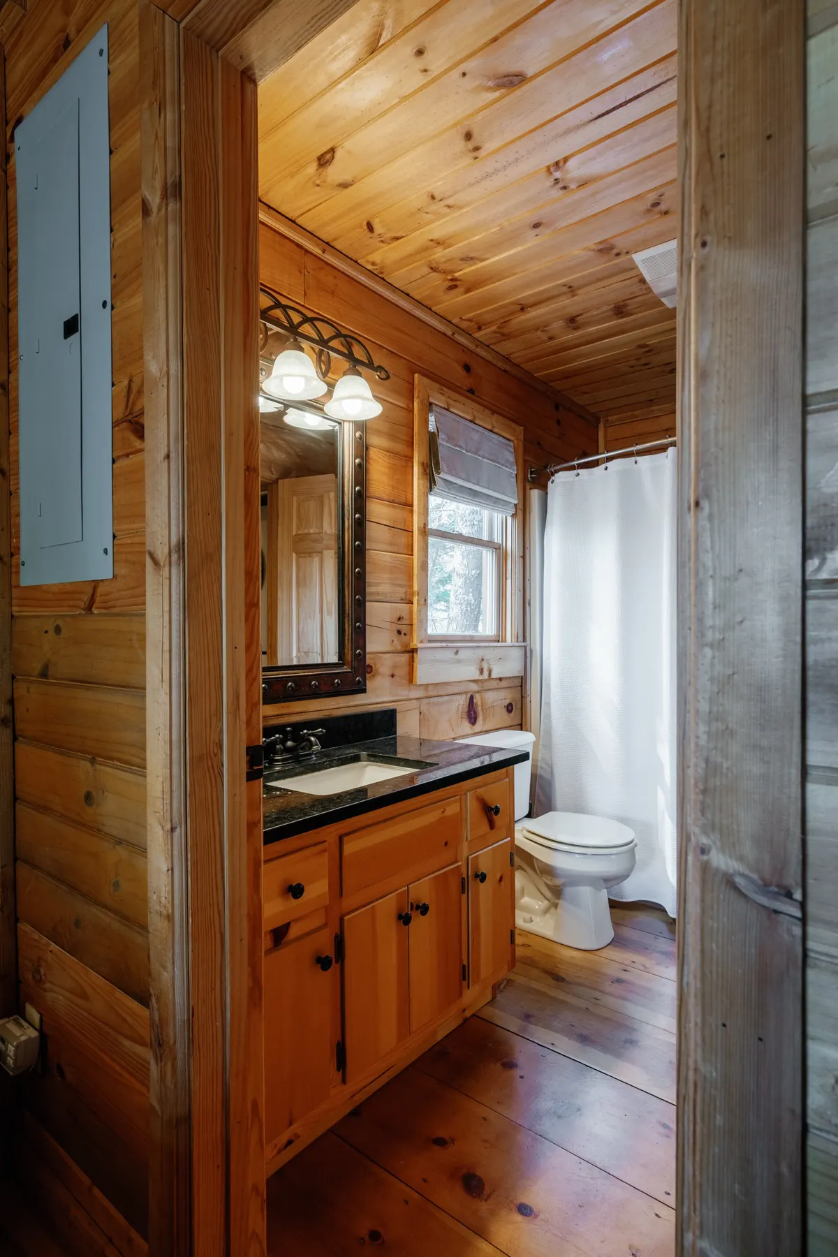 Main level bathroom with plush towels, dual shower head, and luxury toiletries