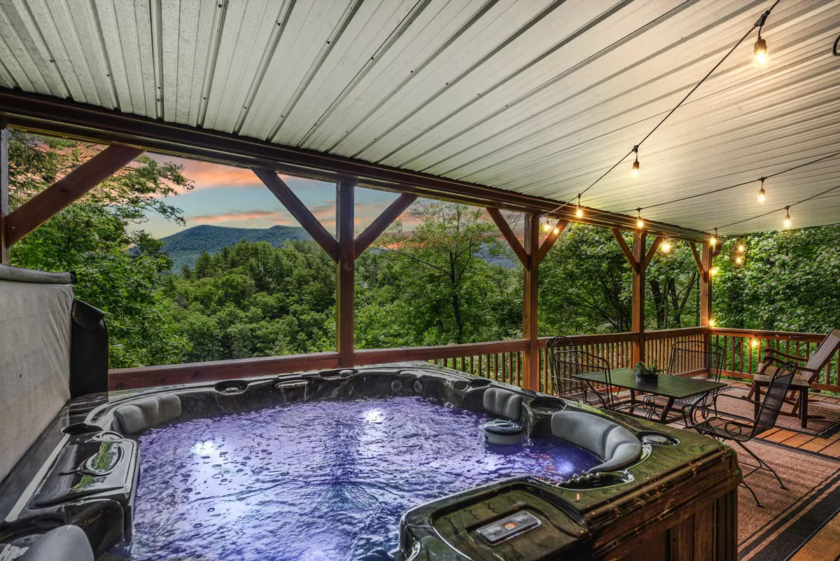 Lower deck with covered hot tub, dining, and seating areas to enjoy the view