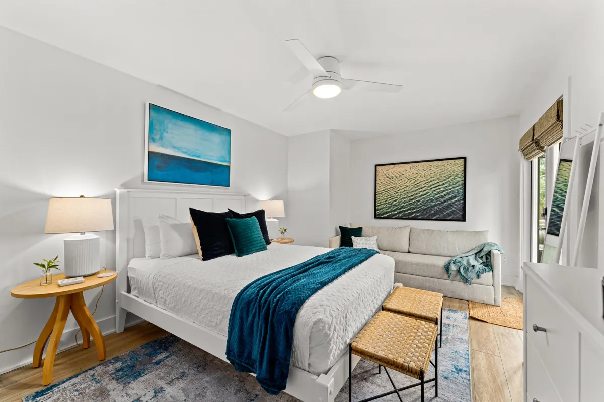 Main level queen bedroom with luxury firm mattress and a futon style sleeper sofa
