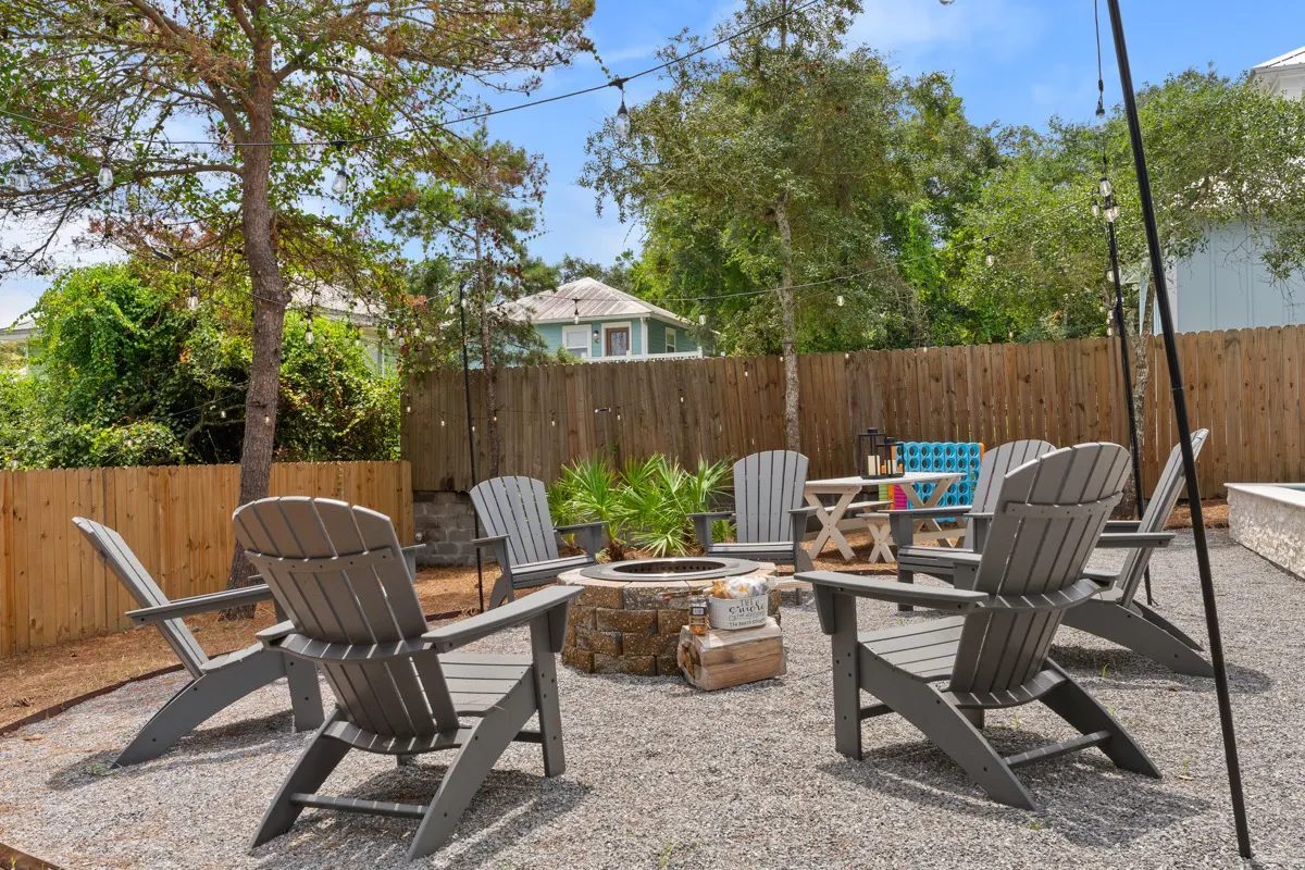 Eight oversized adirondack chairs around our Breeo smokeless fire pit