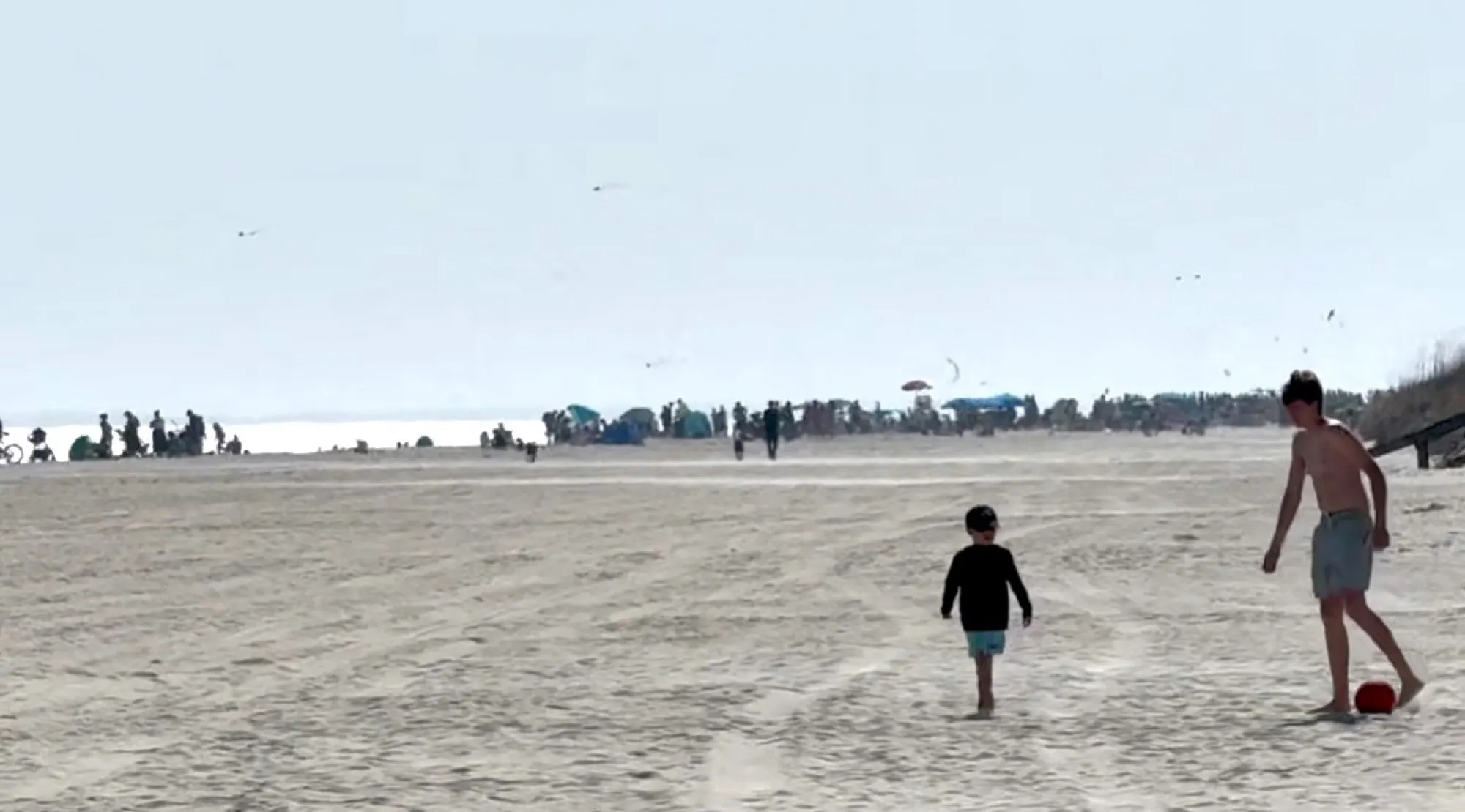 View of crowded Coligny Beach in peak summer from our beach access