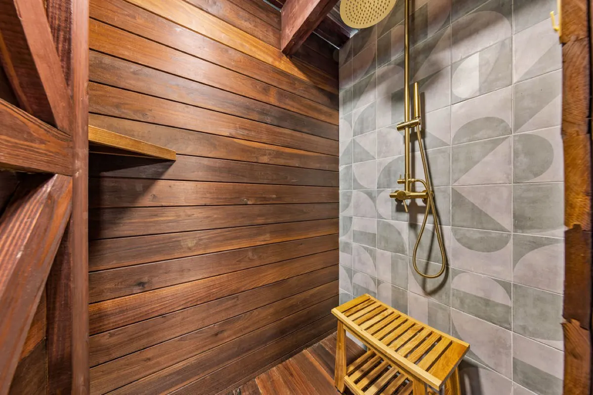 Private outdoor teak shower with rain head